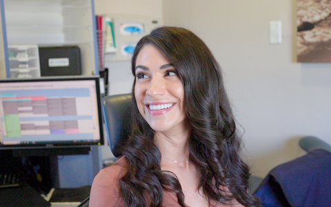 woman with dark hair smiling