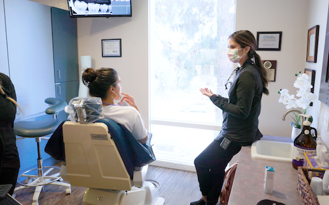 Dr. Etesse discussing ozone therapy with a patient in Solana Beach