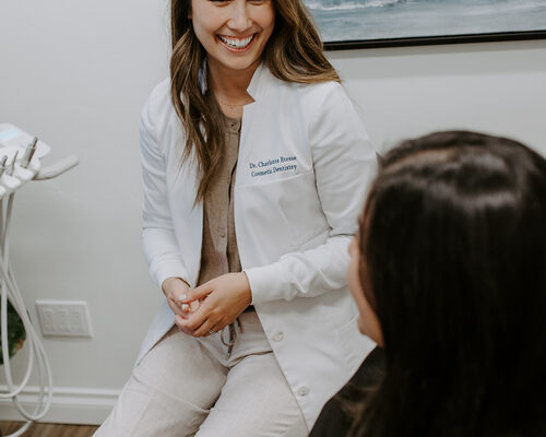 Dr. Etesse consulting with a patient for professional teeth whitening.