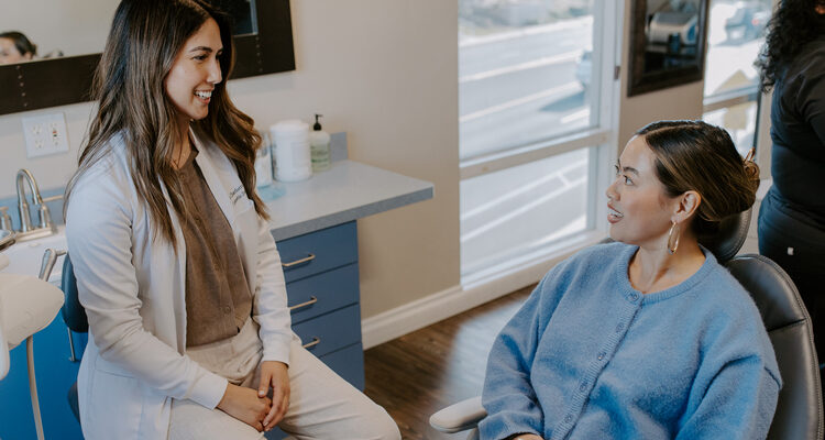 Dr. Etesse collaborating with a holistic dentistry patient on their care.